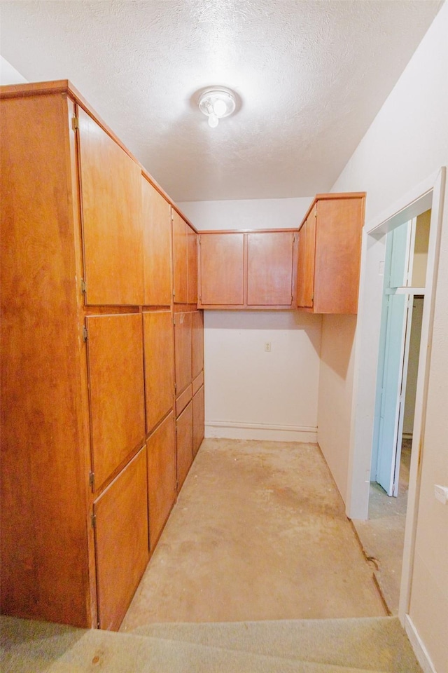 1809 Stevens St, Bridgeport, TX 76426 - hall with a textured ceiling and concrete flooring
