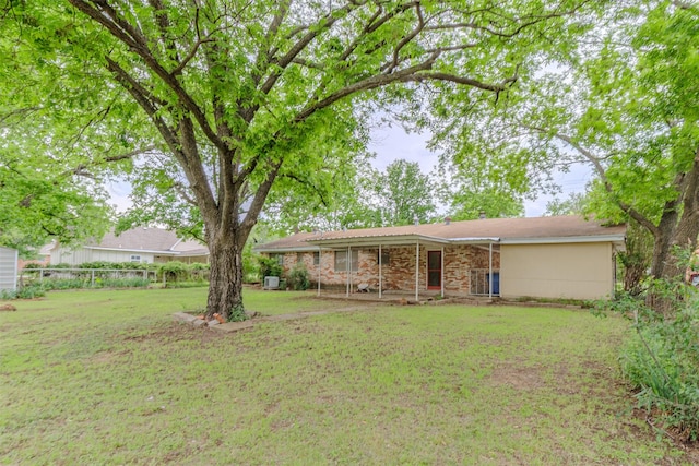 1809 Stevens St, Bridgeport, TX 76426 - rear view of house with a lawn