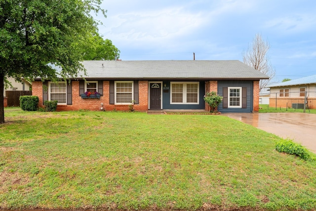ranch-style house featuring brick siding and concrete driveway