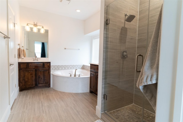 2974 Sparks Dr, Frisco, TX 75036 - full bath with vanity, a garden tub, and a stall shower