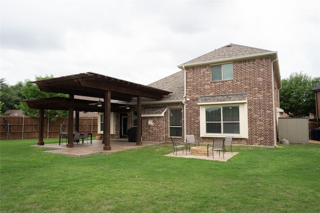 2974 Sparks Dr, Frisco, TX 75036 - back of house featuring a patio area, roof with shingles, ceiling fan, an outdoor fire pit, and brick siding