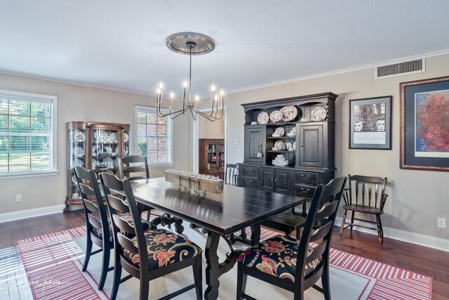 6030 Arden St, Shreveport, LA 71106 - dining space with a chandelier, plenty of natural light, baseboards, and crown molding
