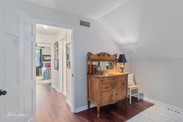 6030 Arden St, Shreveport, LA 71106 - hallway featuring vaulted ceiling, wood finished floors, and baseboards