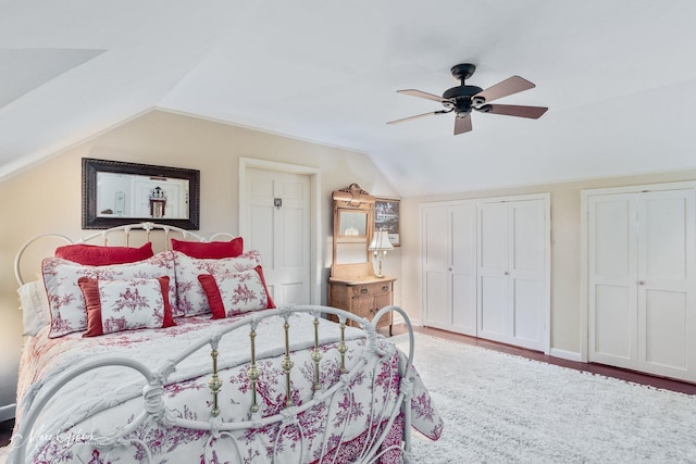 6030 Arden St, Shreveport, LA 71106 - bedroom with vaulted ceiling, multiple closets, ceiling fan, and wood finished floors