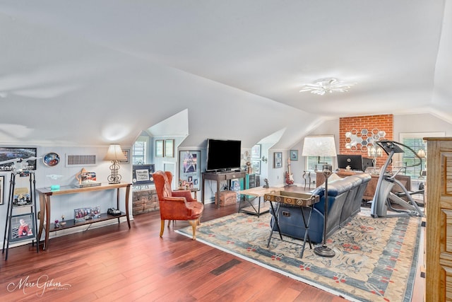 6030 Arden St, Shreveport, LA 71106 - living room featuring lofted ceiling, wood finished floors, healthy amount of natural light, and ceiling fan