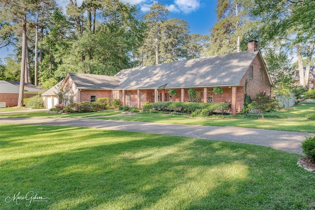 6030 Arden St, Shreveport, LA 71106 - single story home featuring brick siding, a front lawn, and a chimney