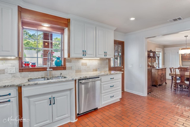 6030 Arden St, Shreveport, LA 71106 - kitchen featuring dishwasher, a sink, decorative backsplash, brick floors, and white cabinets
