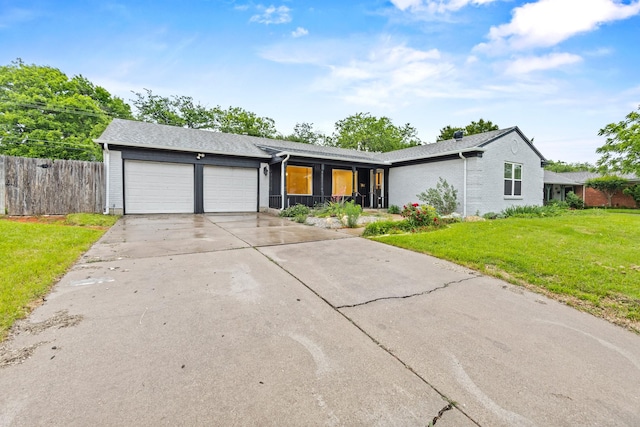 2909 Conejos Dr, Fort Worth, TX 76116 - view of front of home with an attached garage, driveway, and brick siding