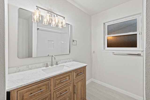 2909 Conejos Dr, Fort Worth, TX 76116 - bathroom featuring vanity and baseboards
