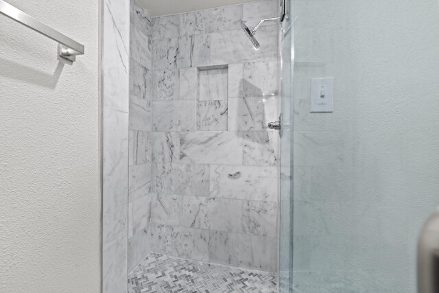 2909 Conejos Dr, Fort Worth, TX 76116 - full bathroom featuring a stall shower and a textured wall
