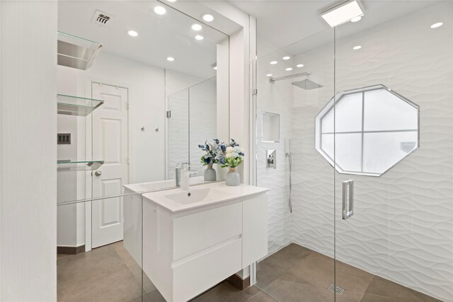 bathroom with a stall shower, vanity, recessed lighting, and tile patterned floors