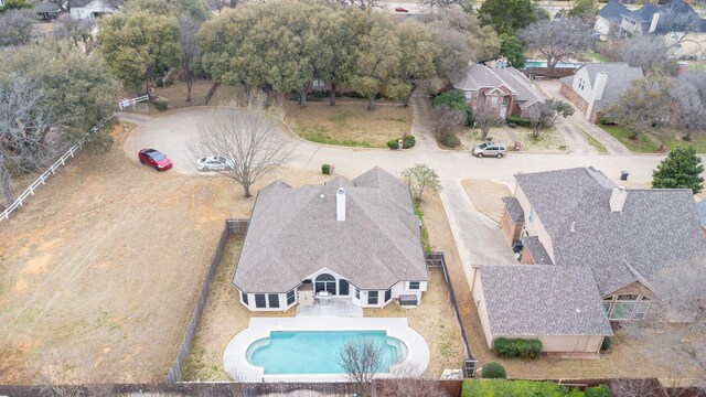 aerial perspective of suburban area with a pool area