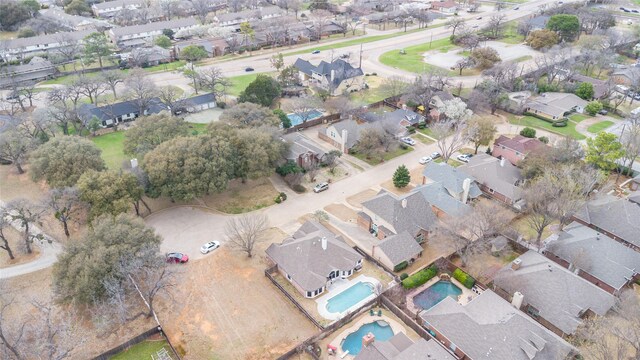 view of property location featuring nearby suburban area and a pool area