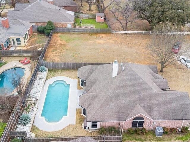 view from above of property featuring a pool