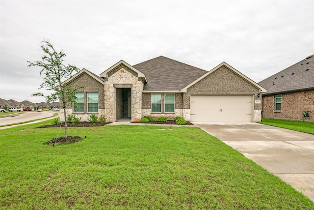 222 Redbarn Ln, Caddo Mills, TX 75135 - view of front of home with an attached garage, driveway, stone siding, a front lawn, and brick siding
