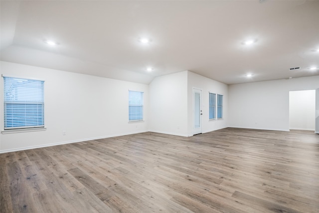 222 Redbarn Ln, Caddo Mills, TX 75135 - empty room with vaulted ceiling, recessed lighting, light wood-type flooring, and baseboards
