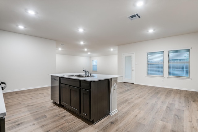 222 Redbarn Ln, Caddo Mills, TX 75135 - kitchen featuring a sink, dishwasher, a center island with sink, light wood-style flooring, and light countertops