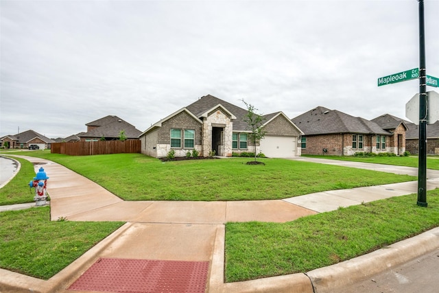 222 Redbarn Ln, Caddo Mills, TX 75135 - view of front facade featuring stone siding, driveway, a residential view, and a shingled roof