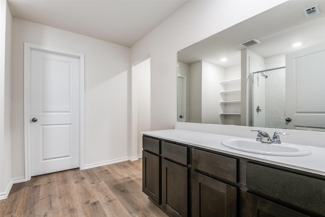 222 Redbarn Ln, Caddo Mills, TX 75135 - full bathroom featuring wood finished floors, a shower, vanity, and baseboards