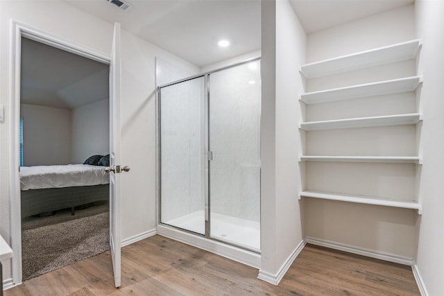 222 Redbarn Ln, Caddo Mills, TX 75135 - ensuite bathroom featuring wood finished floors, a stall shower, baseboards, and recessed lighting