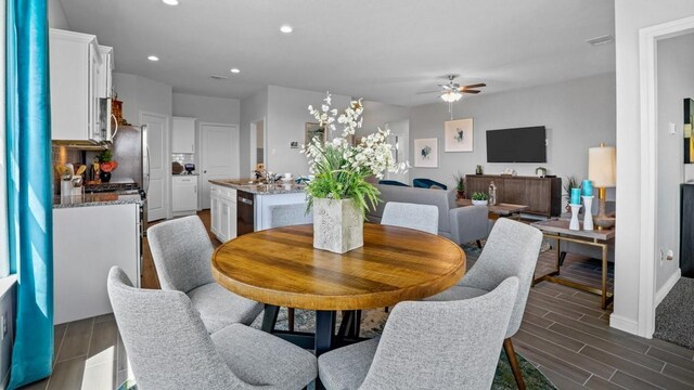 212 Trinity St, Grandview, TX 76050 - dining room featuring ceiling fan, recessed lighting, wood finish floors, and baseboards