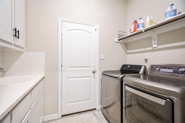 3224 Greymoore Dr, Anna, TX 75409 - laundry area with washing machine and clothes dryer, cabinet space, and baseboards