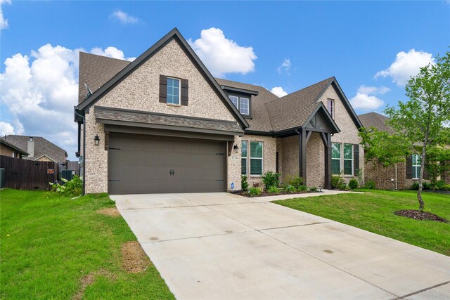 3224 Greymoore Dr, Anna, TX 75409 - view of front facade with driveway, a garage, brick siding, and central air condition unit