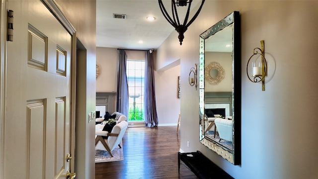 hallway with baseboards, dark wood finished floors, and recessed lighting