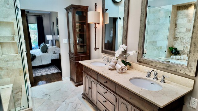 bathroom featuring ensuite bathroom and double vanity
