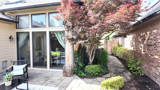 property entrance featuring a patio area