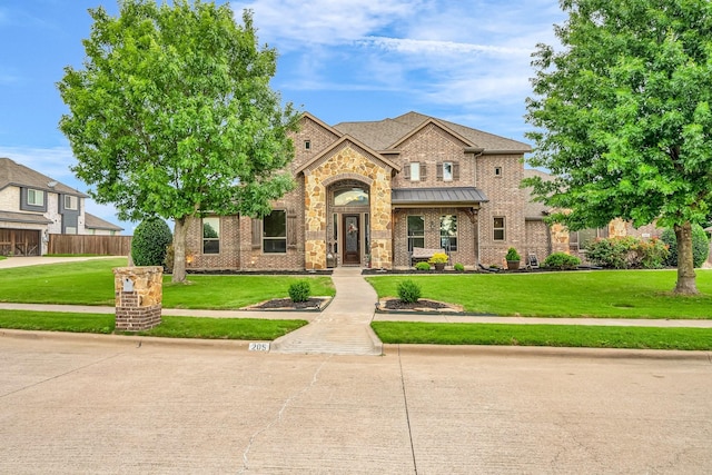 view of front facade with brick siding and stone siding