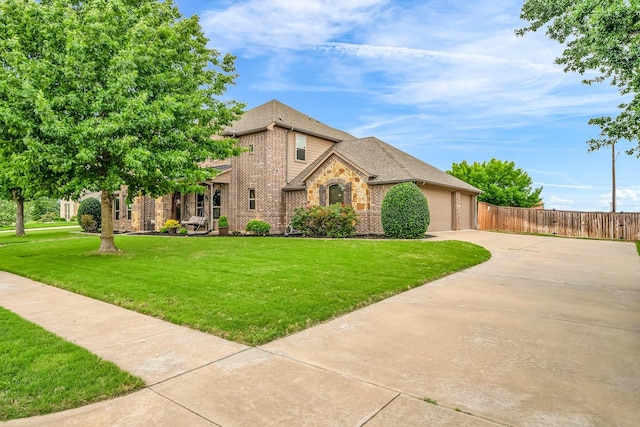 french country style house with concrete driveway, brick siding, an attached garage, and roof with shingles