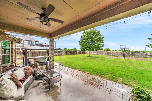 view of patio / terrace with a gazebo, ceiling fan, and an outdoor living space