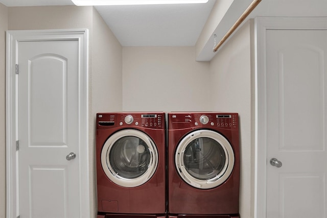 washroom with washing machine and dryer