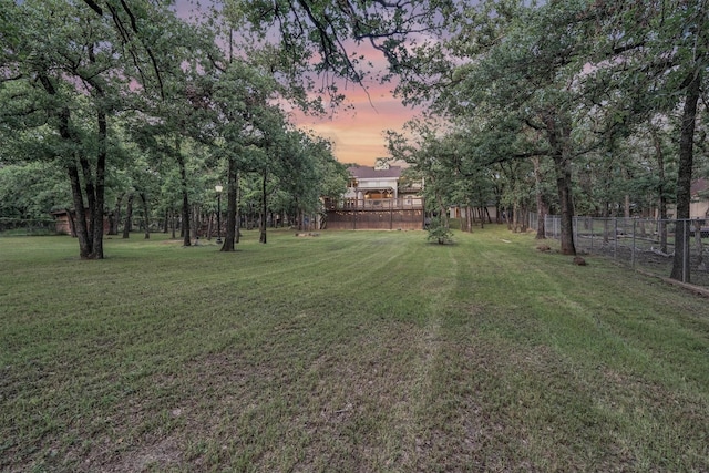 view of yard at dusk