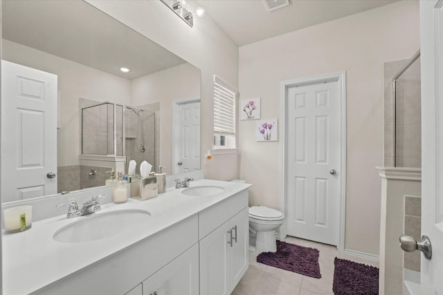 1145 Vernon Dr, Aubrey, TX 76227 - bathroom with tiled shower, tile patterned flooring, toilet, and double vanity