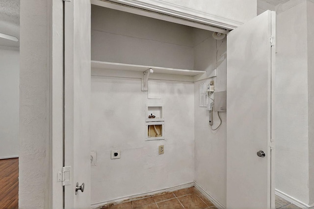 laundry area featuring hookup for an electric dryer, washer hookup, and tile patterned floors