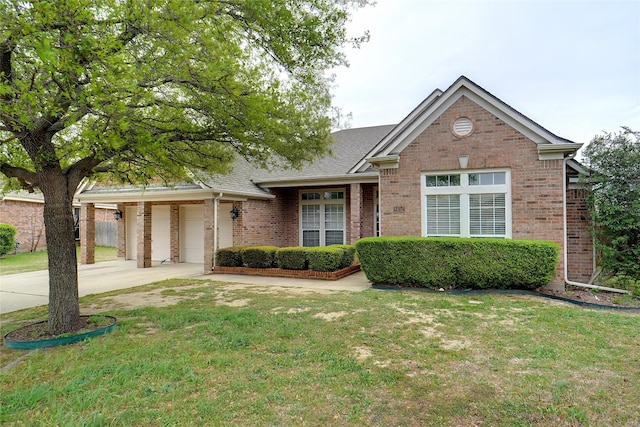 8652 Fernhill Dr, Fort Worth, TX 76123 - view of front of home featuring driveway, brick siding, a front lawn, and a shingled roof