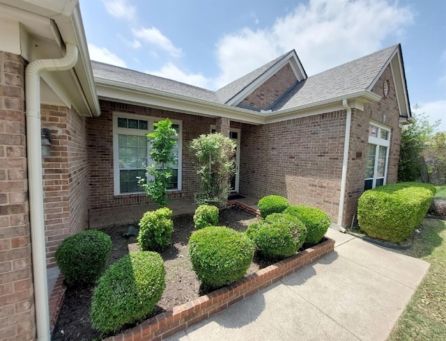 8652 Fernhill Dr, Fort Worth, TX 76123 - living area featuring ceiling fan, wood finished floors, a high end fireplace, arched walkways, and recessed lighting