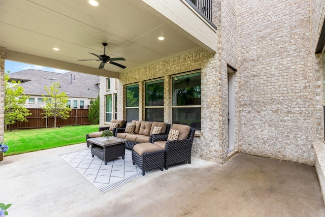 view of patio featuring ceiling fan and an outdoor living space