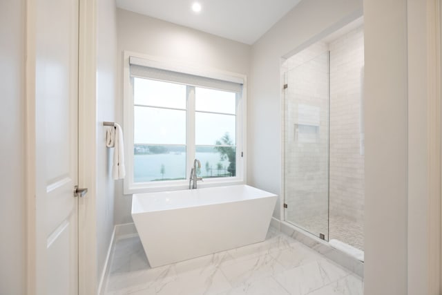 13736 Waterside Dr, Malakoff, TX 75148 - bathroom featuring a stall shower, a freestanding bath, marble finish floors, baseboards, and recessed lighting