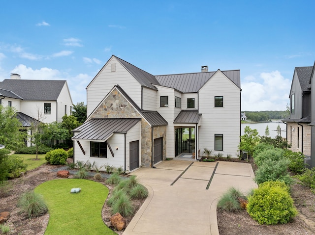 13736 Waterside Dr, Malakoff, TX 75148 - modern inspired farmhouse with a standing seam roof, concrete driveway, a chimney, a garage, and metal roof