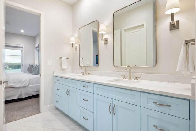 13736 Waterside Dr, Malakoff, TX 75148 - ensuite bathroom with marble look tile flooring, double vanity, and baseboards