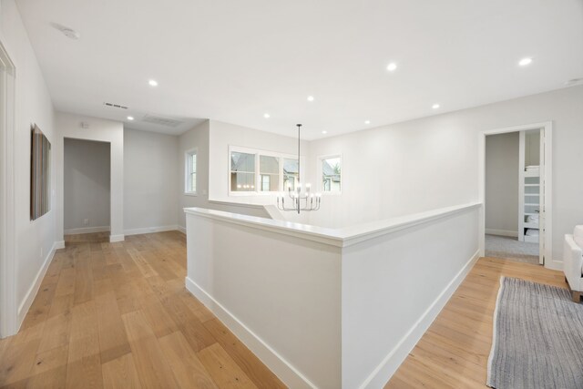 13736 Waterside Dr, Malakoff, TX 75148 - hall with a chandelier, light wood-style floors, baseboards, and recessed lighting