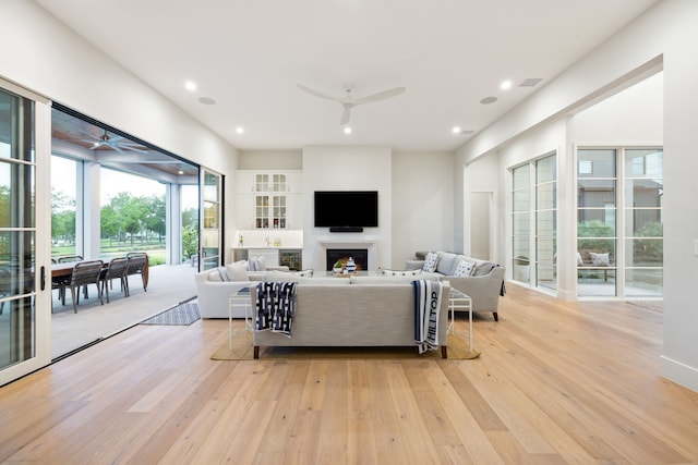 13736 Waterside Dr, Malakoff, TX 75148 - living area featuring a ceiling fan, light wood-type flooring, recessed lighting, and a fireplace