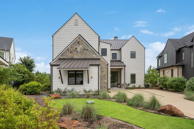 13736 Waterside Dr, Malakoff, TX 75148 - view of front of property with a standing seam roof and a front lawn