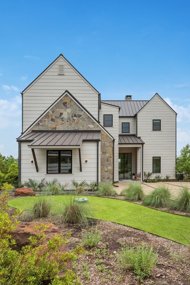 13736 Waterside Dr, Malakoff, TX 75148 - view of front of property with a standing seam roof, a front yard, and metal roof