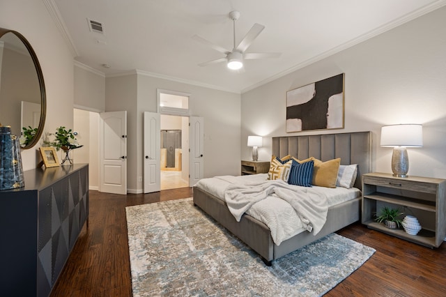 bedroom with crown molding, wood finished floors, baseboards, ceiling fan, and connected bathroom