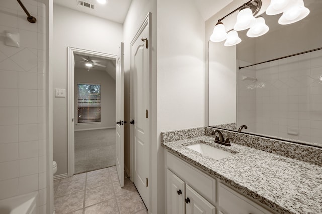 bathroom with vanity, a ceiling fan, toilet, and tile patterned flooring
