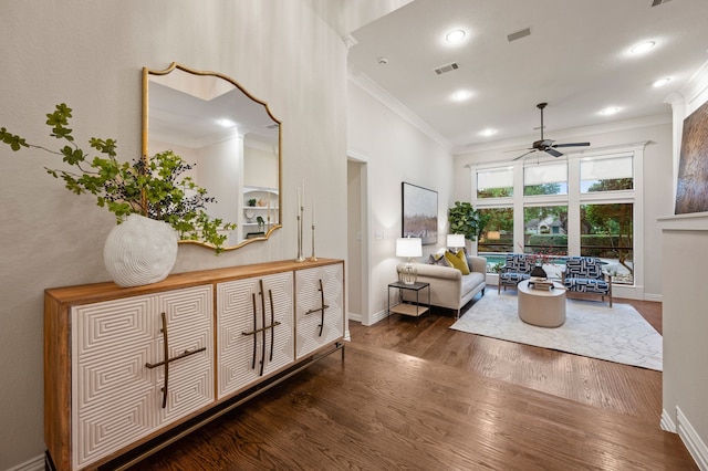 living room featuring a ceiling fan, crown molding, wood finished floors, baseboards, and recessed lighting